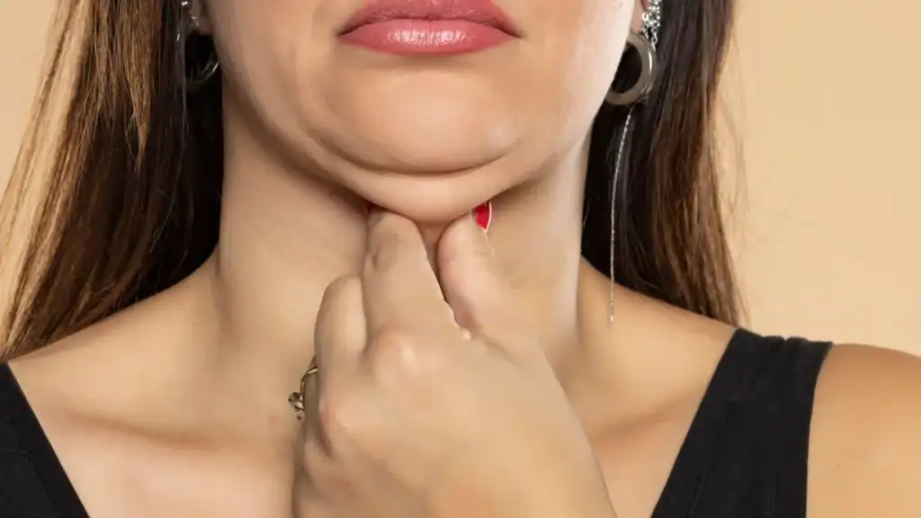 An image of a woman with double chin, sad, worried : Non Surgical Double Chin Removal Treatment in Hickstead, UK
