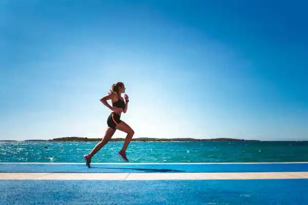 Woman running showing strong leg muscle Hickstead